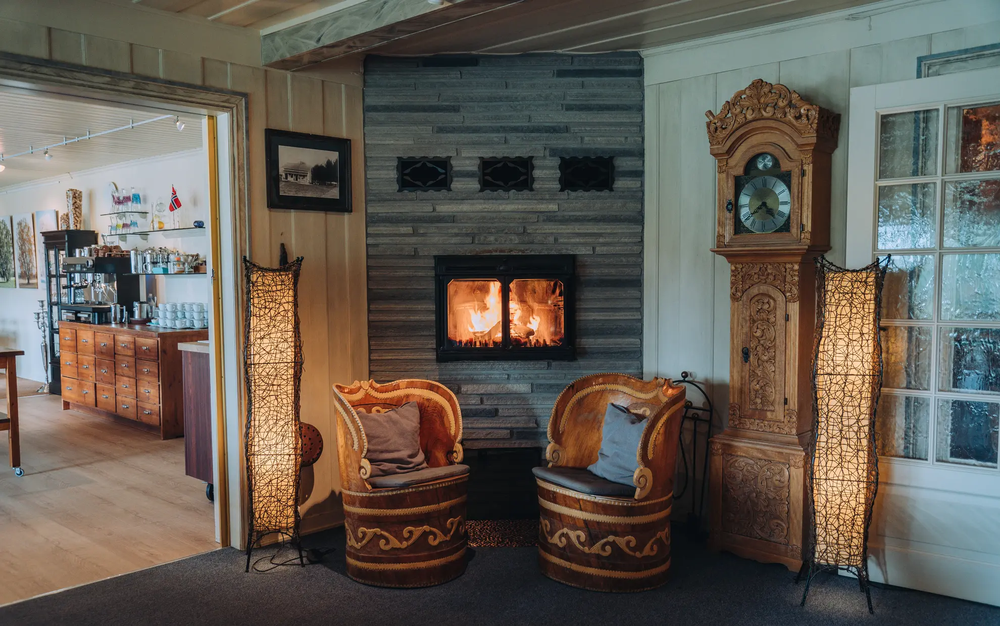 The fireplace is lit by the restaurant